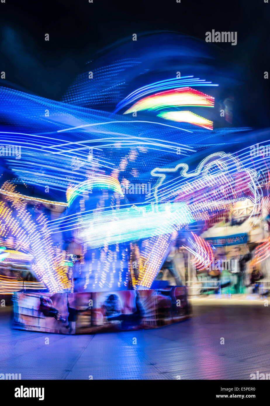 Scattered light trails from a fairground ride at night, Munich Spring