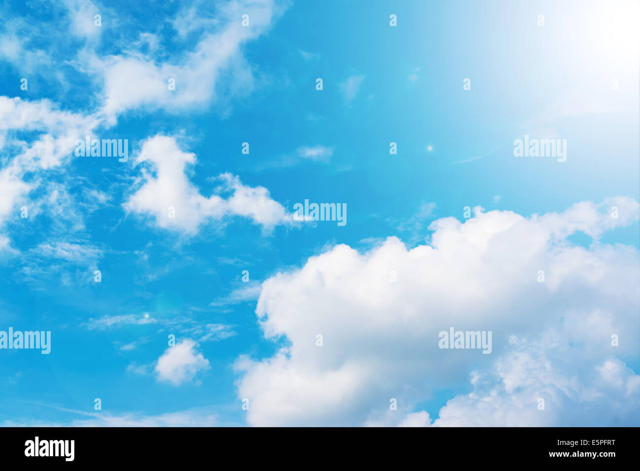 Beautiful summer Blue sky with clouds and sun. Stock Photo