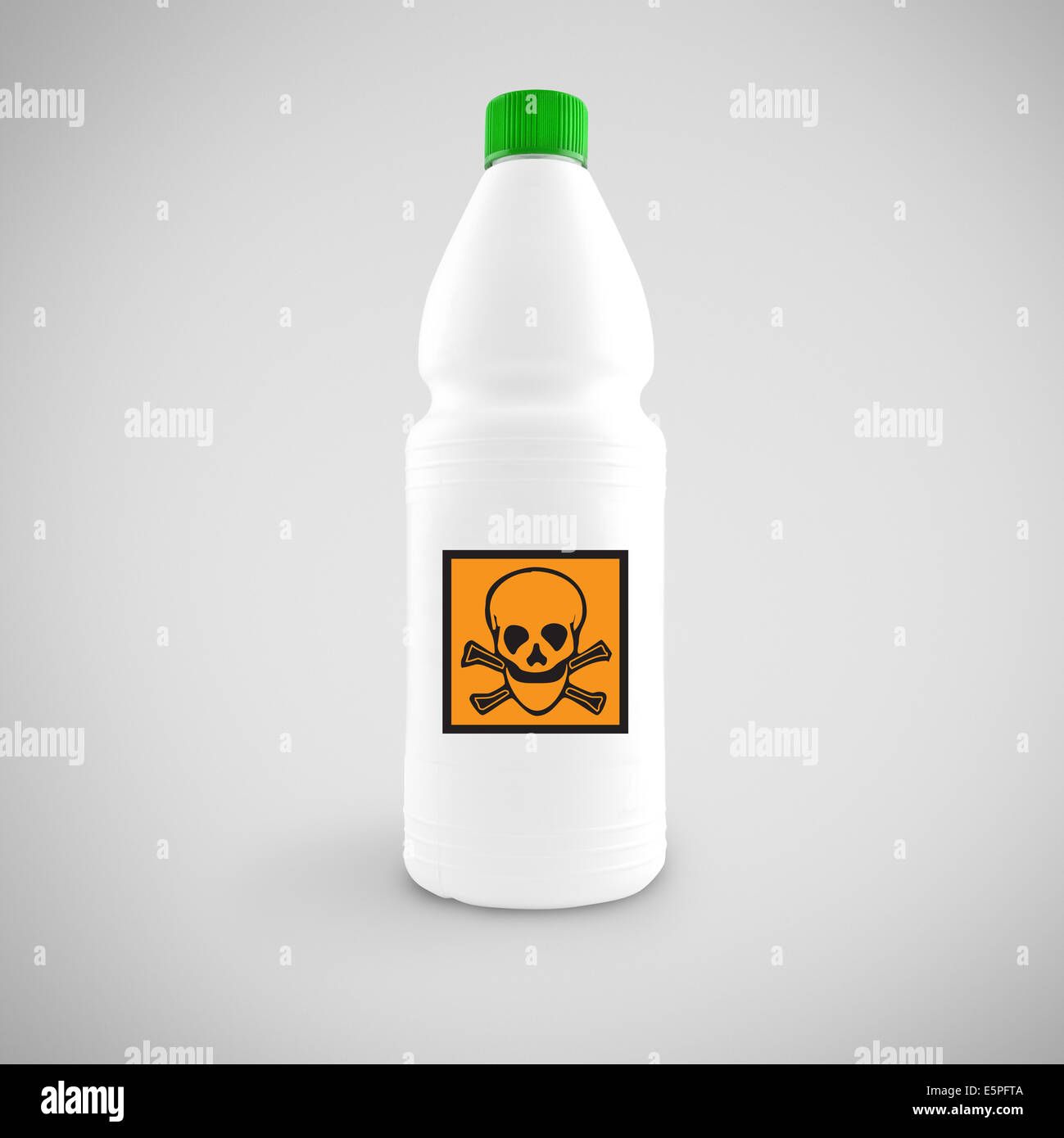 Bottle of chemical liquid with hazard symbol for toxic material Stock Photo