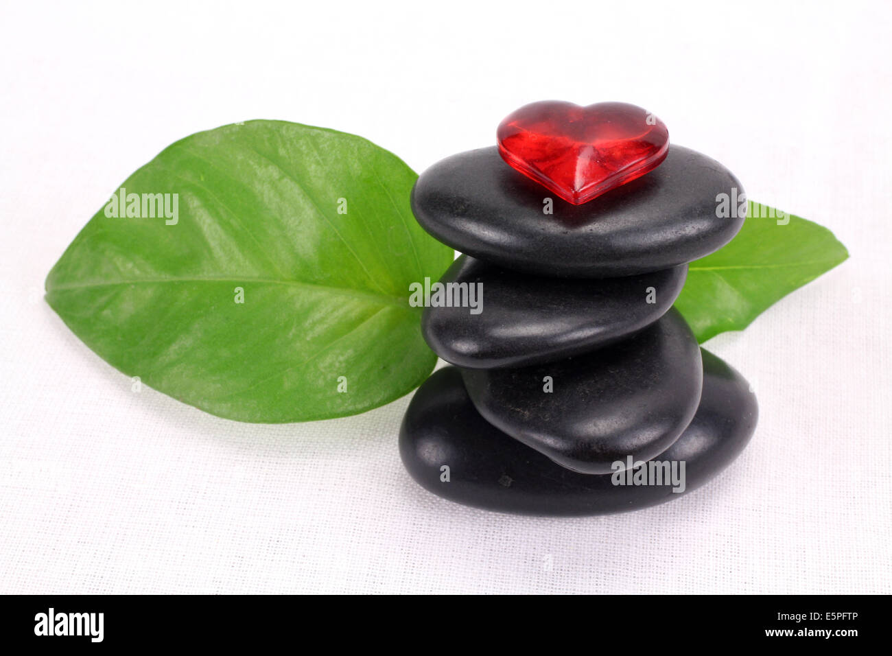 A pile of balanced black spa therapy stones Stock Photo