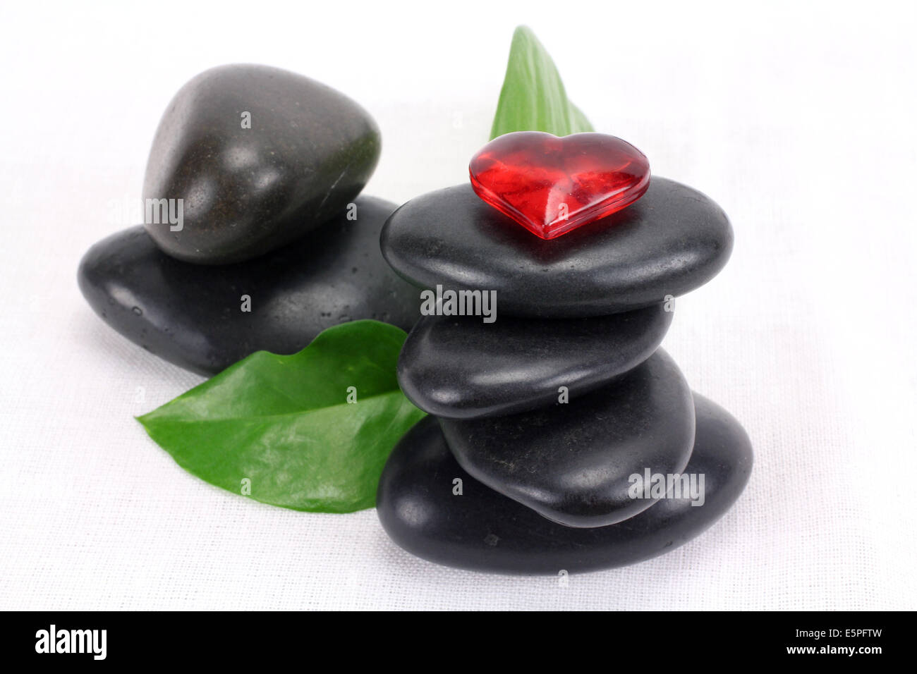 A pile of balanced black spa therapy stones Stock Photo