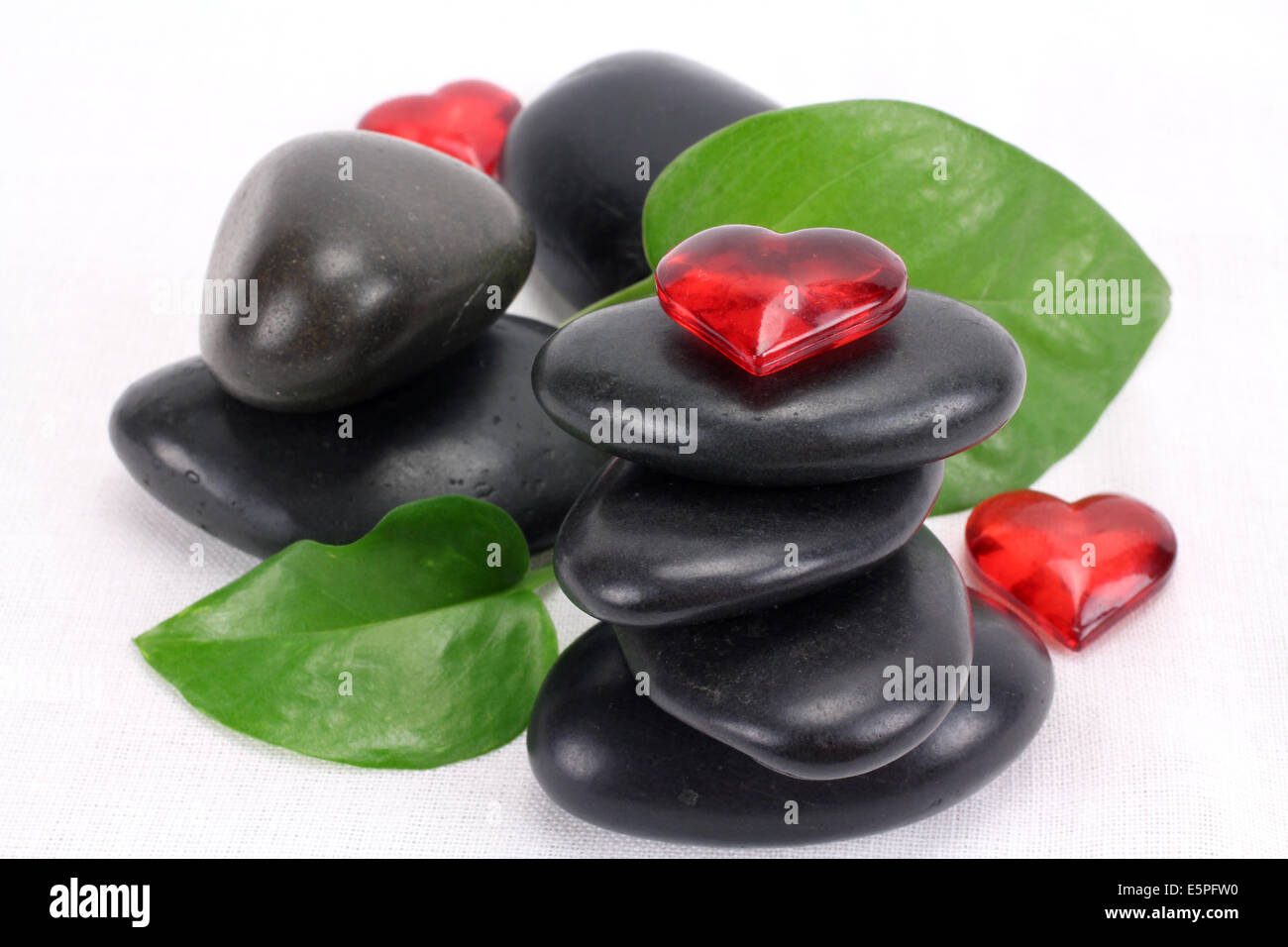A pile of balanced black spa therapy stones Stock Photo