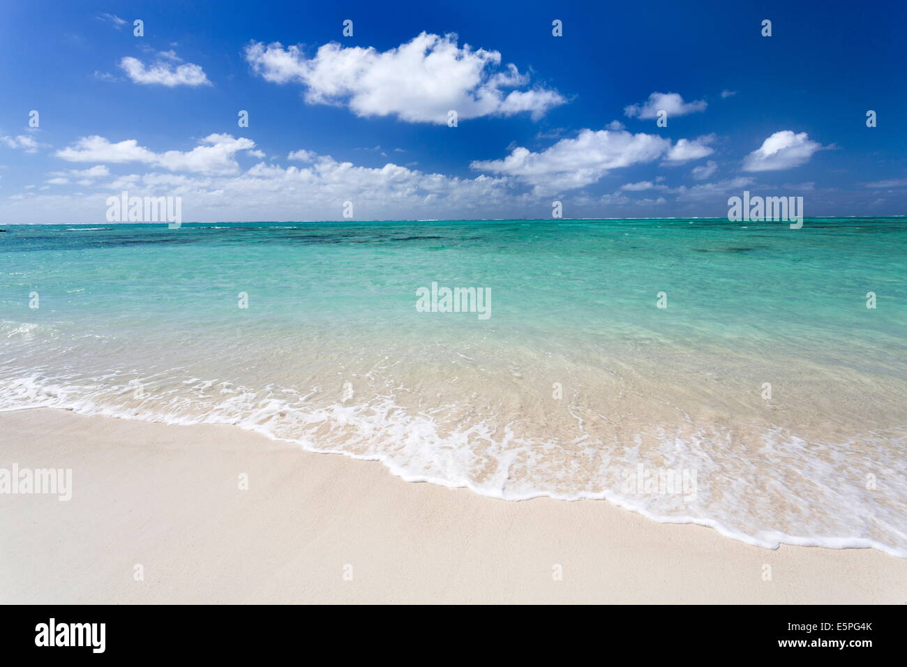 Idyllic beach scene with blue sky, aquamarine sea and soft sand, Ile Aux Cerfs, Mauritius, Indian Ocean, Africa Stock Photo