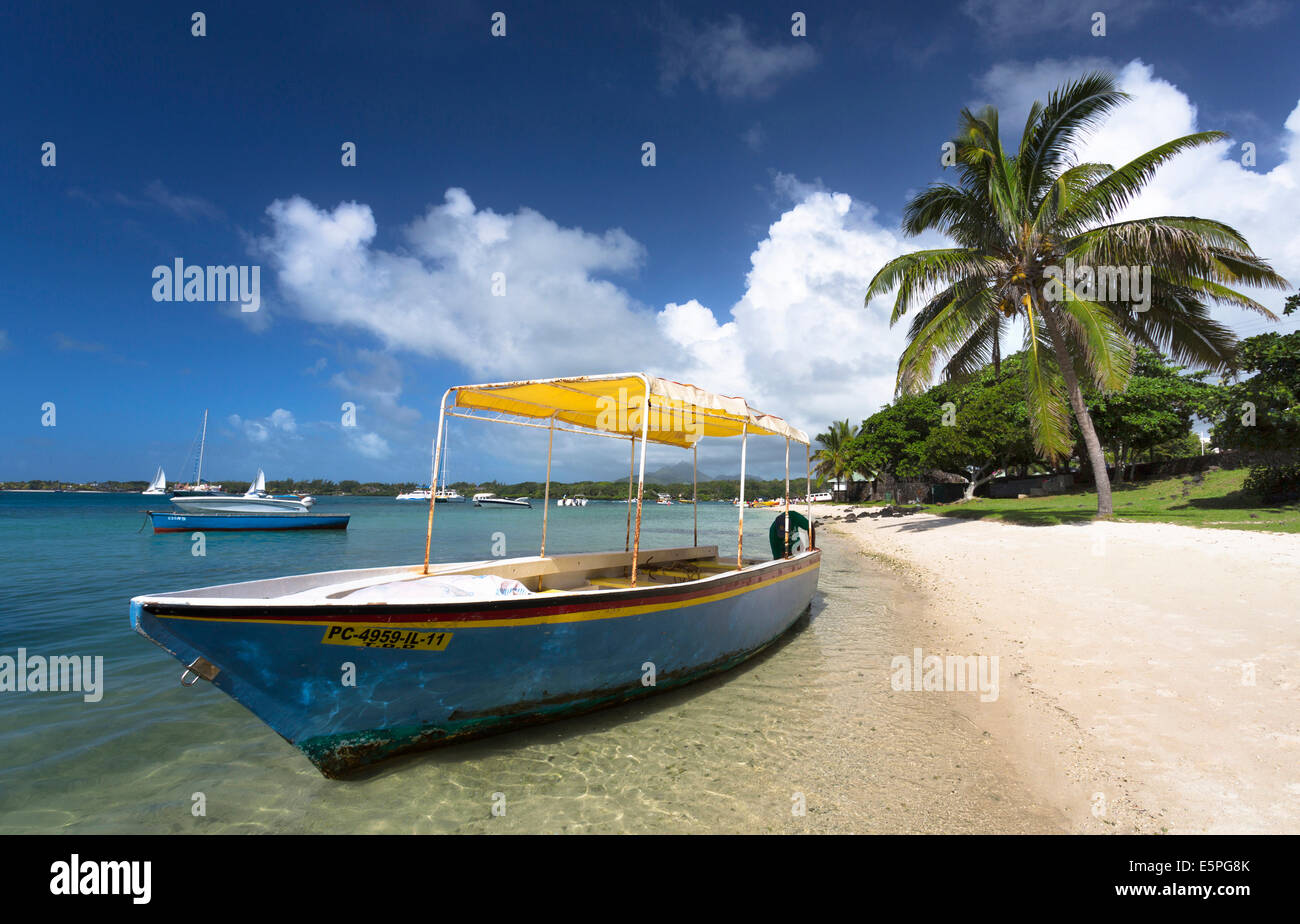 Beach scene at Trou D'eu Douce where tourists catch ferries to the island of Ile Aux Cerfs, Mauritius Stock Photo