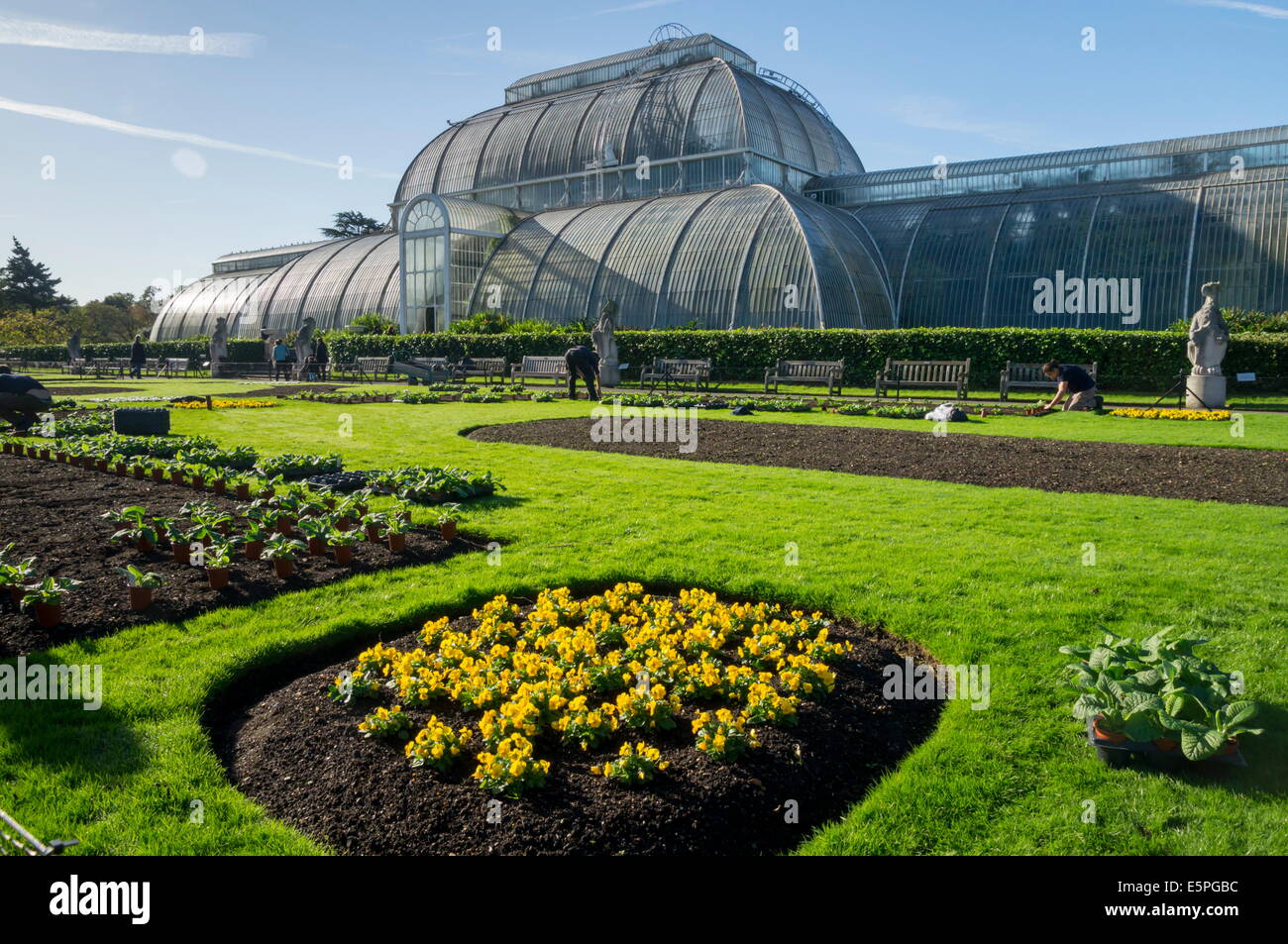 Kew Gardens Palm House with newly planted spring flowers, Royal Botanic ...