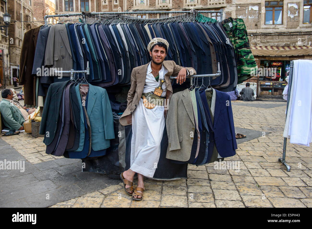 Man selling clothes in the Old Town, UNESCO World Heritage Site, Sanaa, Yemen, Middle East Stock Photo