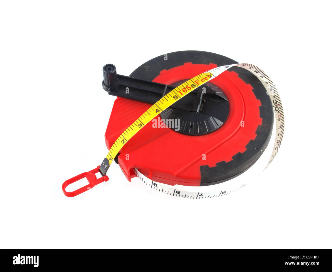 Close up photo of a yellow tape measure on a white background. Stock Photo