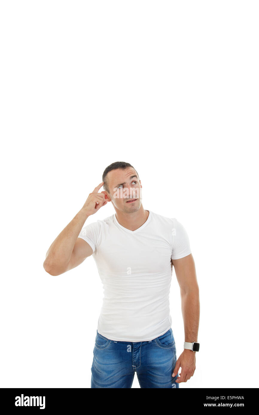 Portrait of the thinking and confused man in casuals looking up in blank copy space with finger on his head Stock Photo