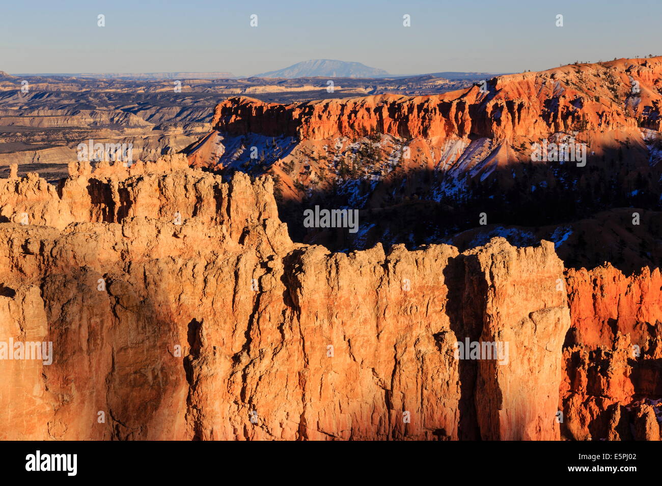 Rocks lit by winter late afternoon sun, from Rim Trail near Sunset Point, Bryce Canyon National Park, Utah, USA Stock Photo