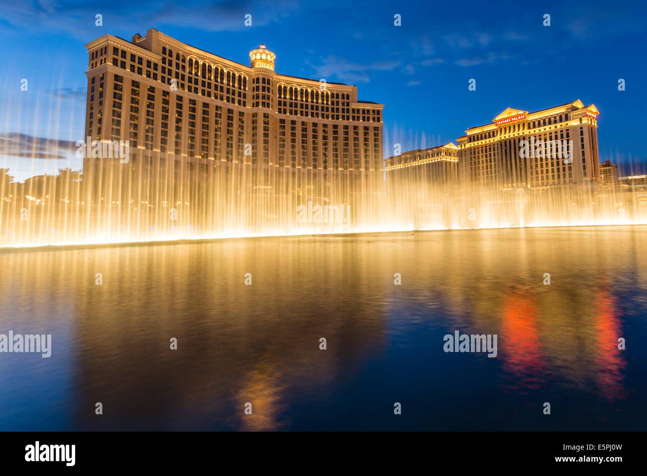 Bellagio and Caesars Palace reflections at dusk with fountains, The Strip, Las Vegas, Nevada, United States of America Stock Photo