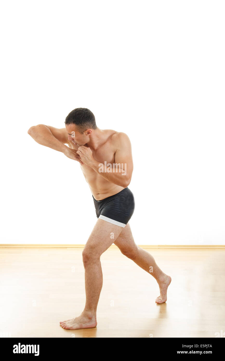 Professional boxing fighter in elbow hit position, Ultimate fighter