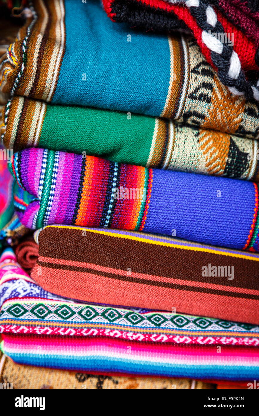 Colorful carpets made of llama and alpaca wool for sale at San Pedro market, Cuzco, Peru. Stock Photo
