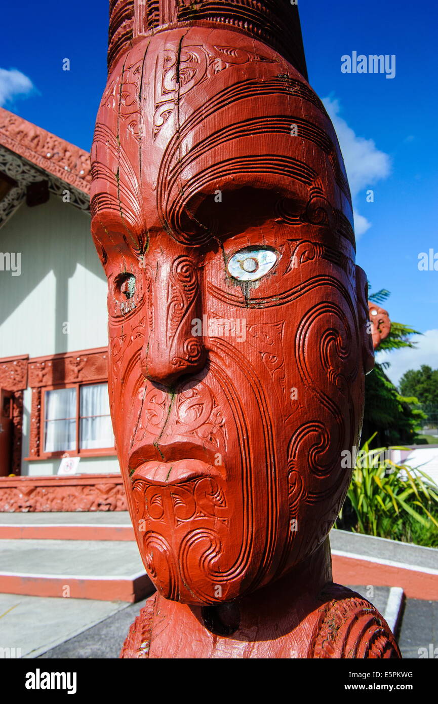 Traditional wood carved mask in the Te Puia Maori Cultural Center, Rotorura, North Island, New Zealand, Pacific Stock Photo