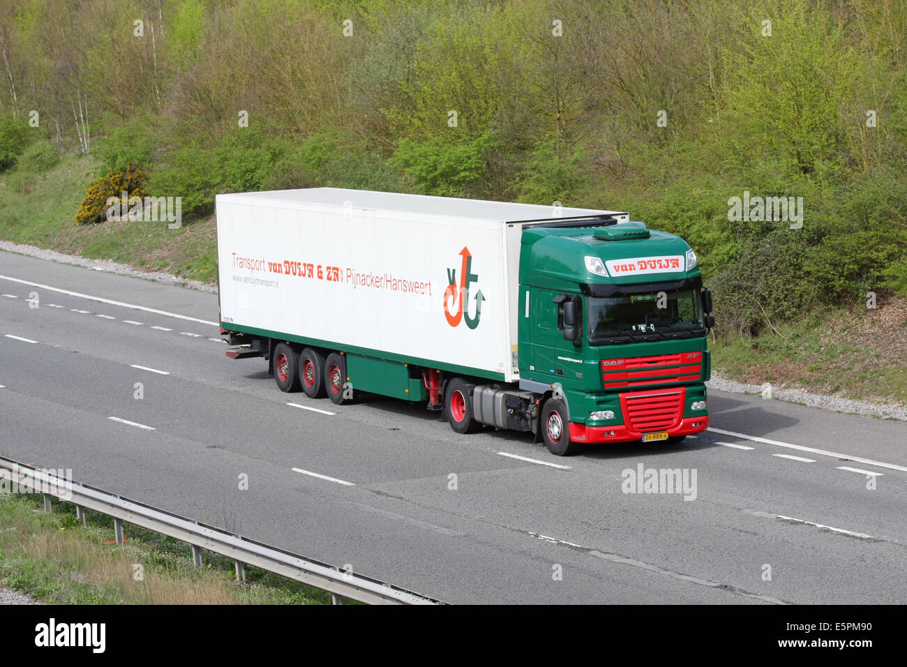 An articulated truck traveling along the M20 motorway in Kent, England Stock Photo