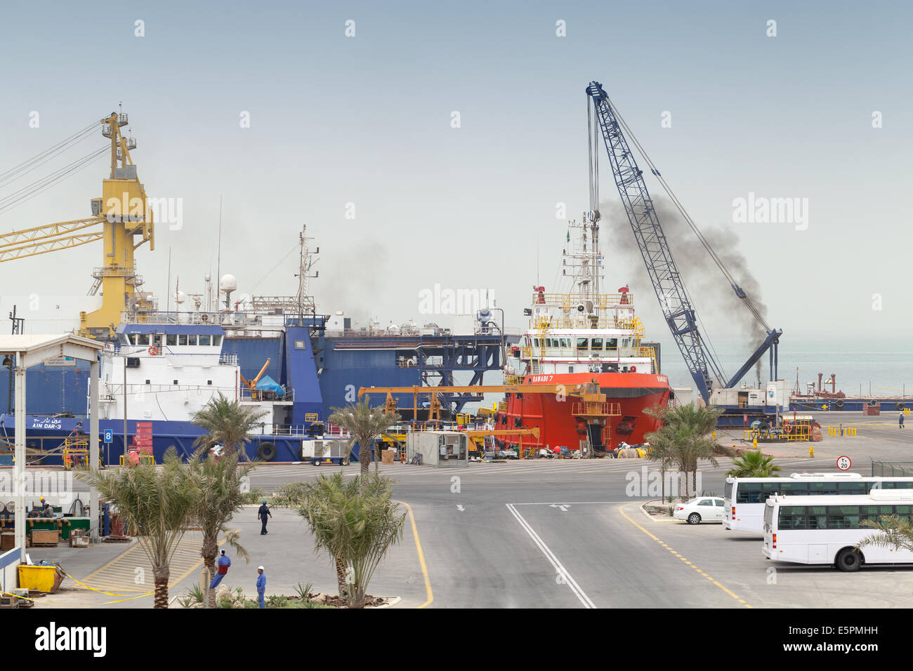 RAS TANURA, SAUDI ARABIA - MAY 13, 2014: Port view with moored ships and workers, Saudi Arabia Stock Photo