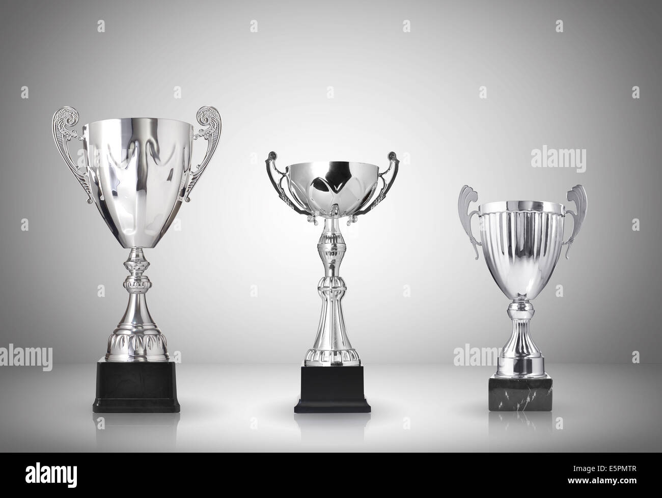 Silver trophies on gray background Stock Photo Alamy