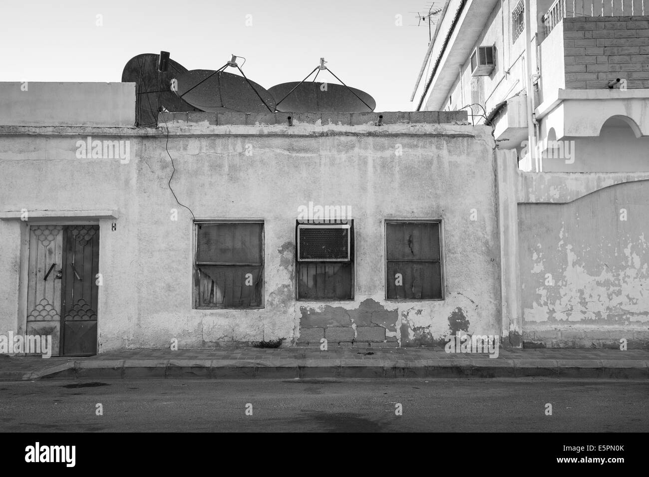 Old building with windows and outer air conditioner device. Saudi Arabia Stock Photo