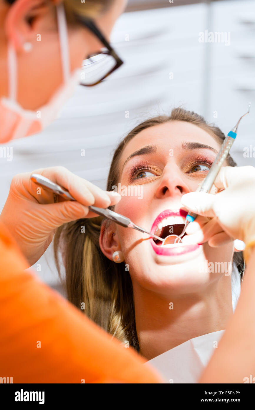 Patient having deep dental tooth cleaning at dentist Stock Photo Alamy