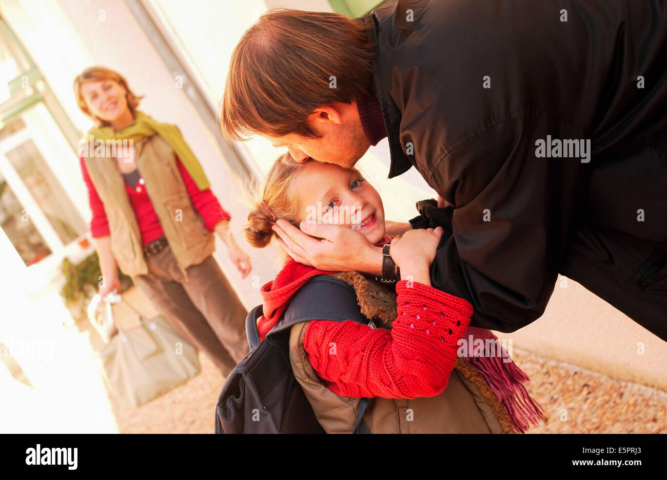 Parents taking their children to school. Stock Photo