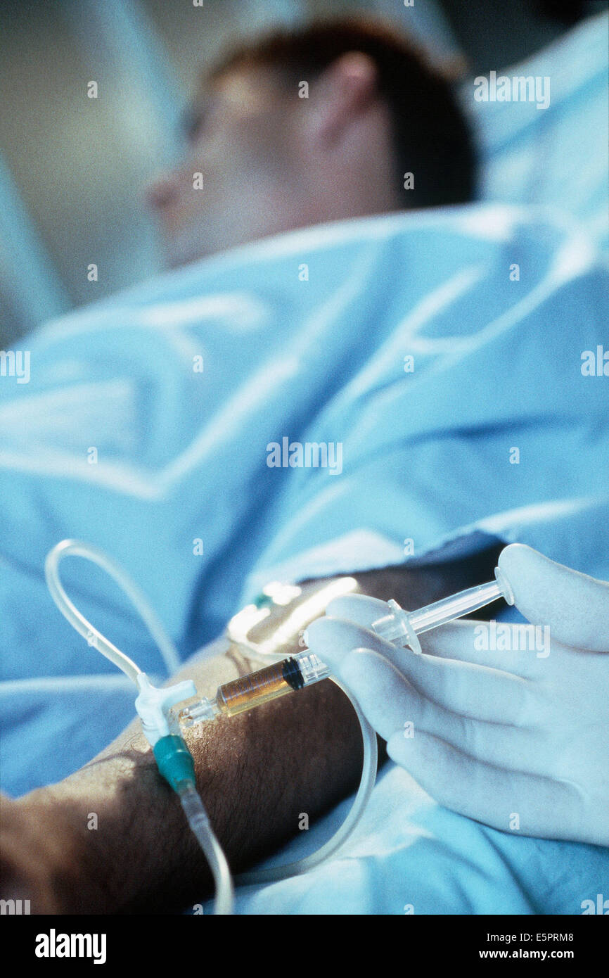 Injection of medication in to a drip system Stock Photo Alamy