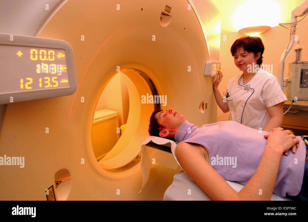 Woman undergoing a Computed Tomography (CT) scan of the brain. Stock Photo