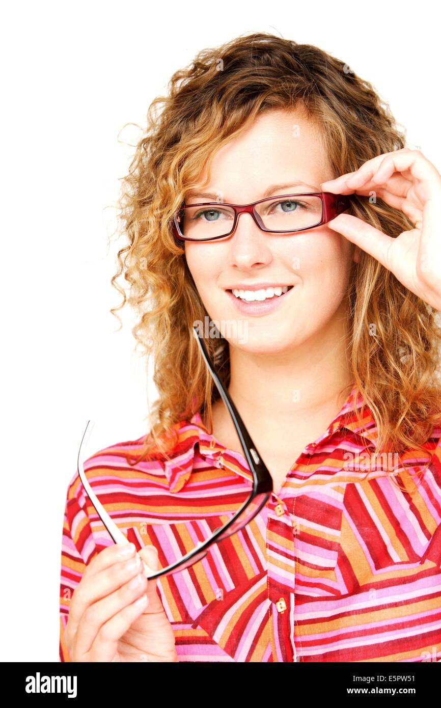 Woman trying different frames for prescription glasses at the optician