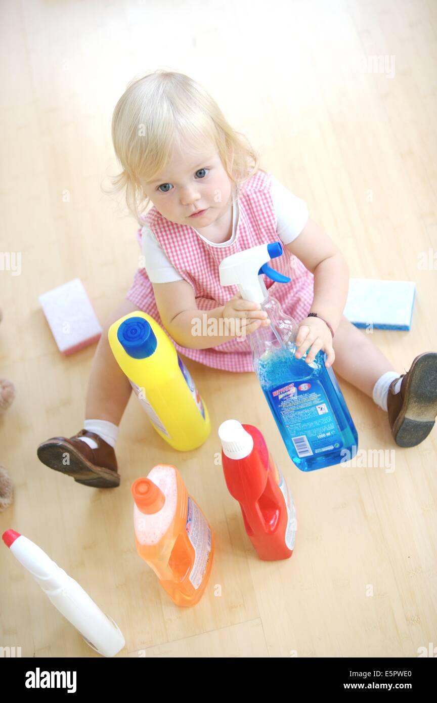 18 month old baby girl playing with house cleaning products, poisoning
