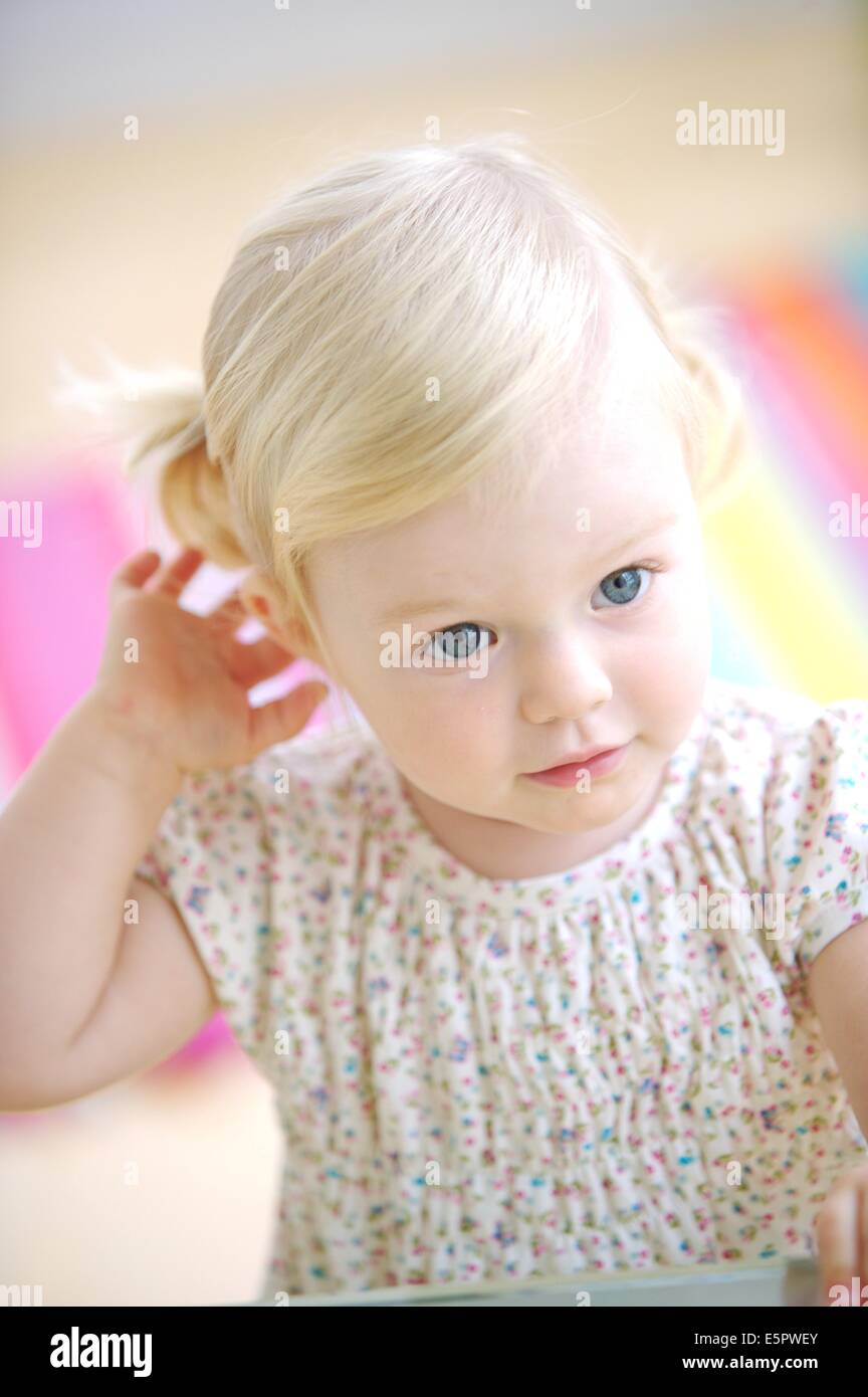 18 month old baby girl showing her hair Stock Photo - Alamy