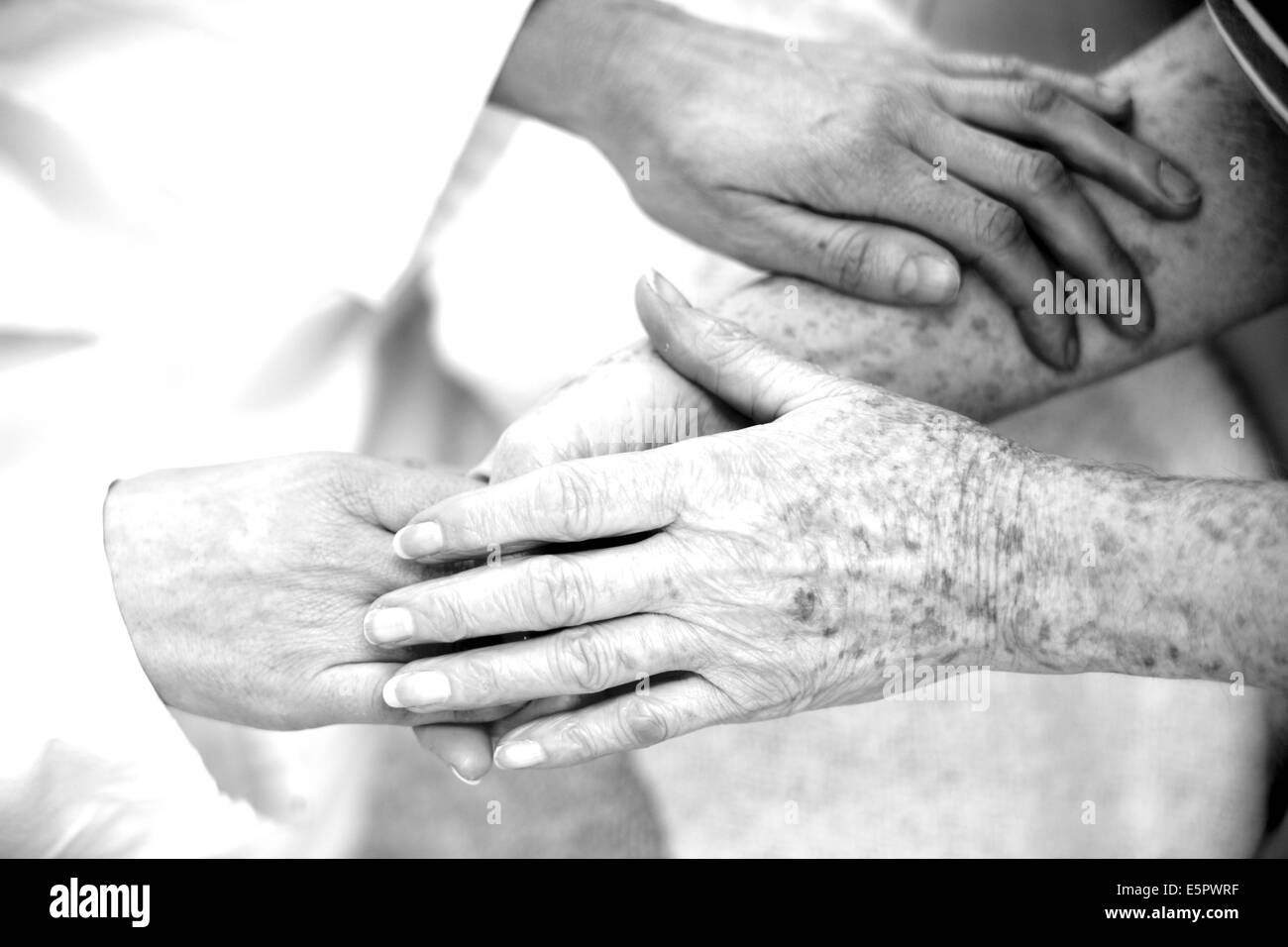 Holding hands of elderly person. Stock Photo