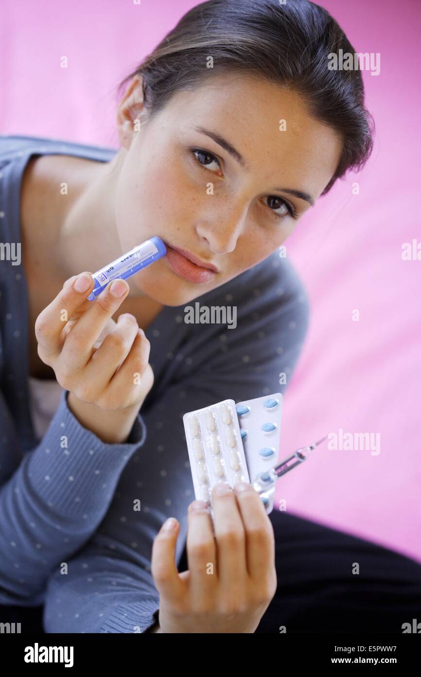 Woman holding medications. Stock Photo