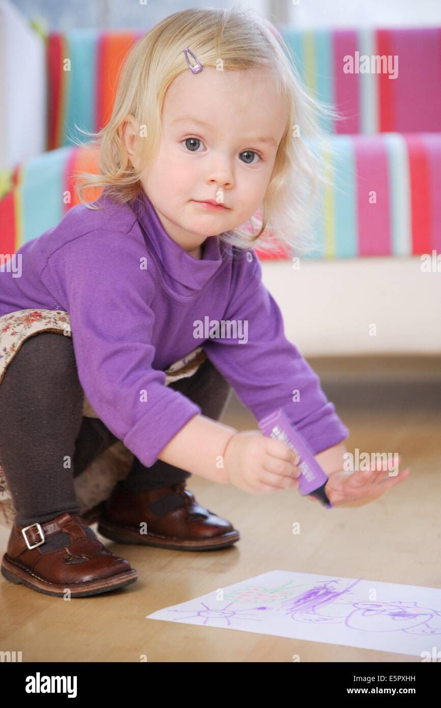 18 month old baby girl drawing. Stock Photo