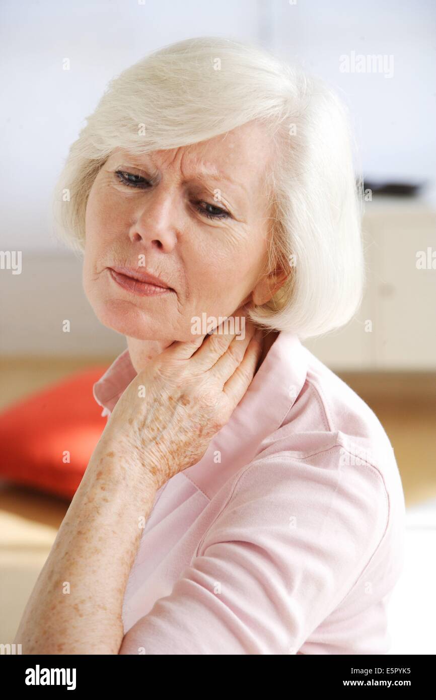 Woman suffering from neck pain Stock Photo Alamy