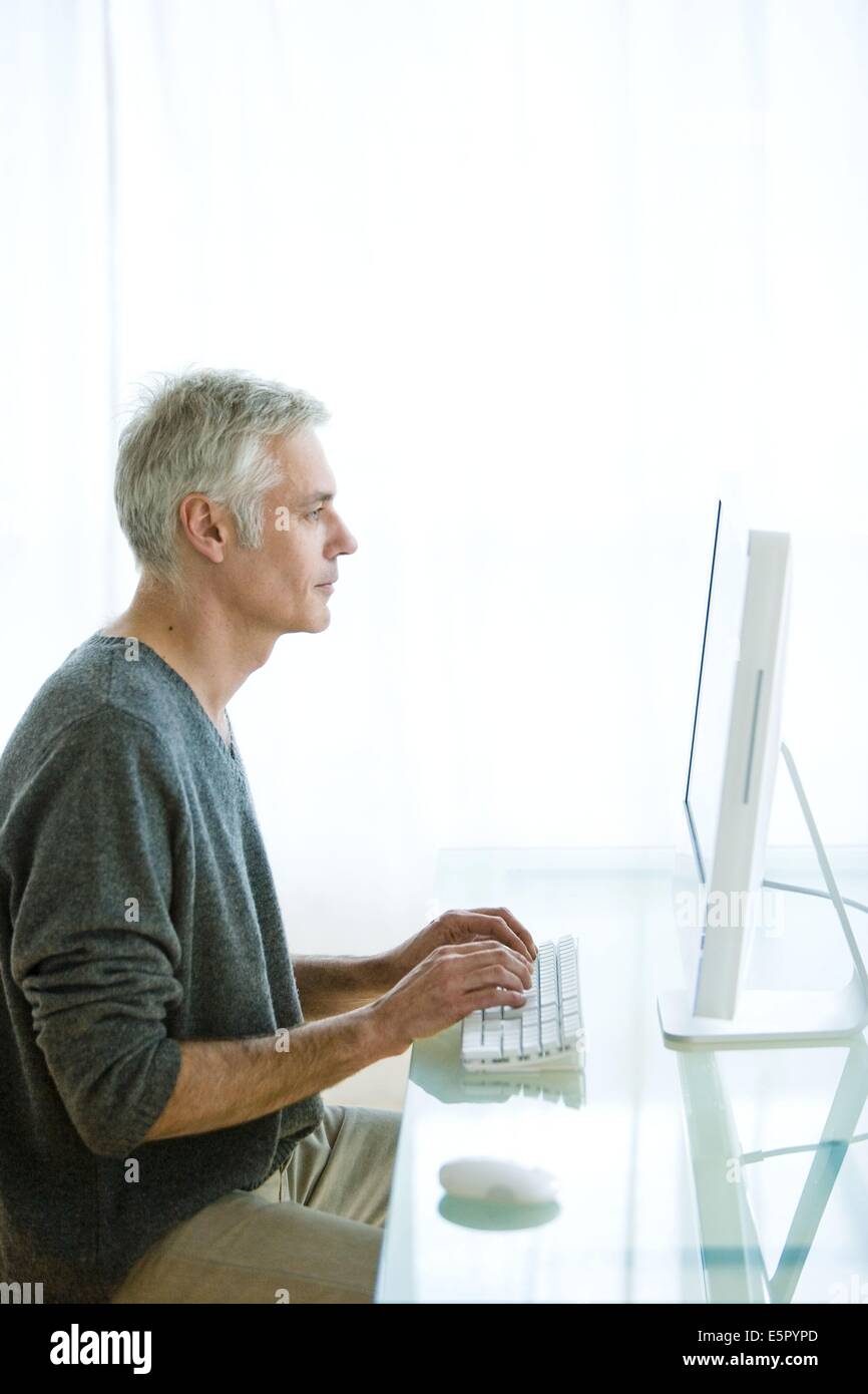 Man using computer Stock Photo - Alamy