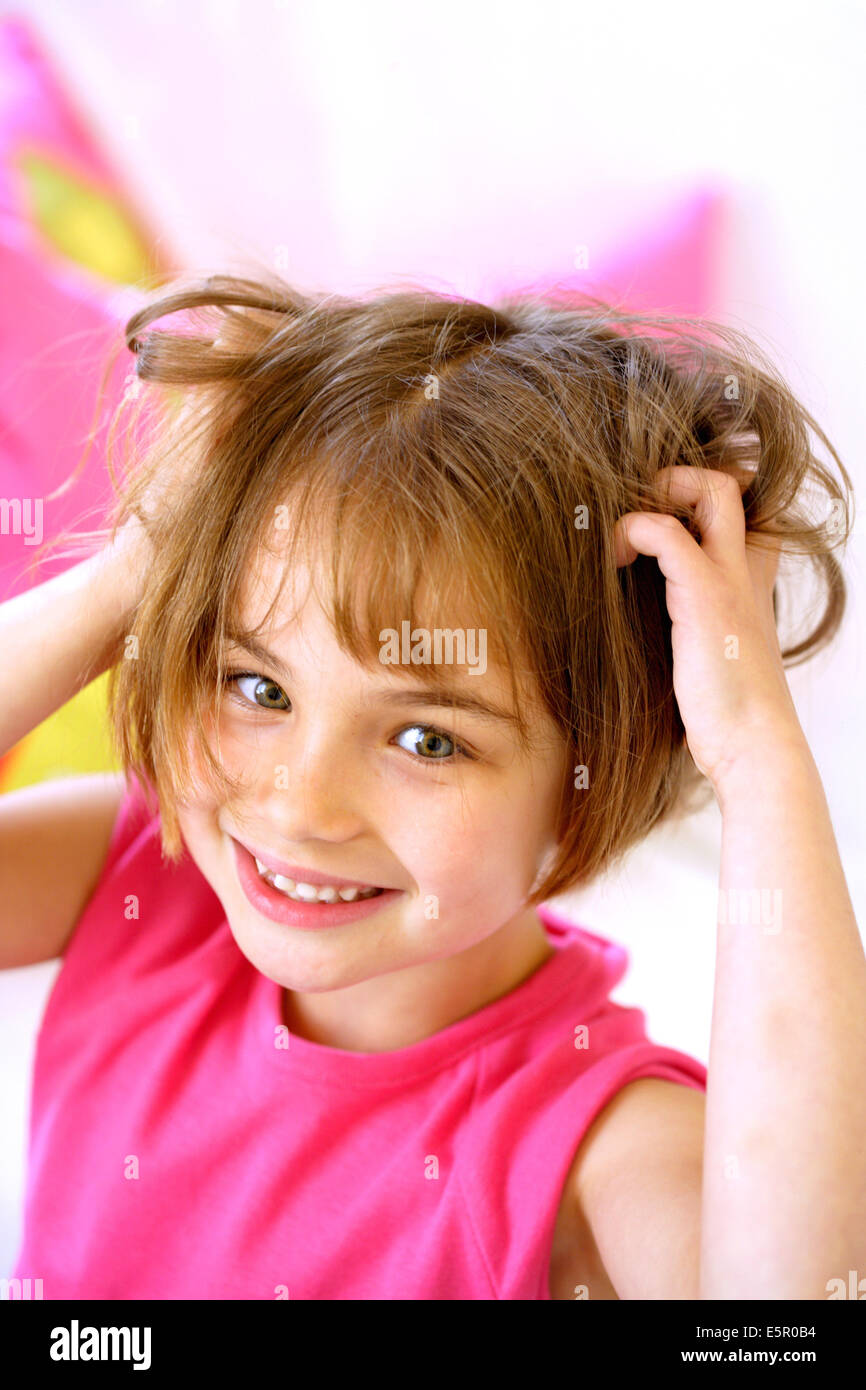 Young girl with itchy scalp Stock Photo Alamy