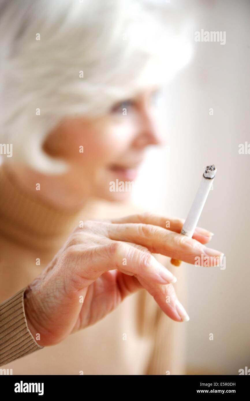 Woman smoking a cigarette Stock Photo