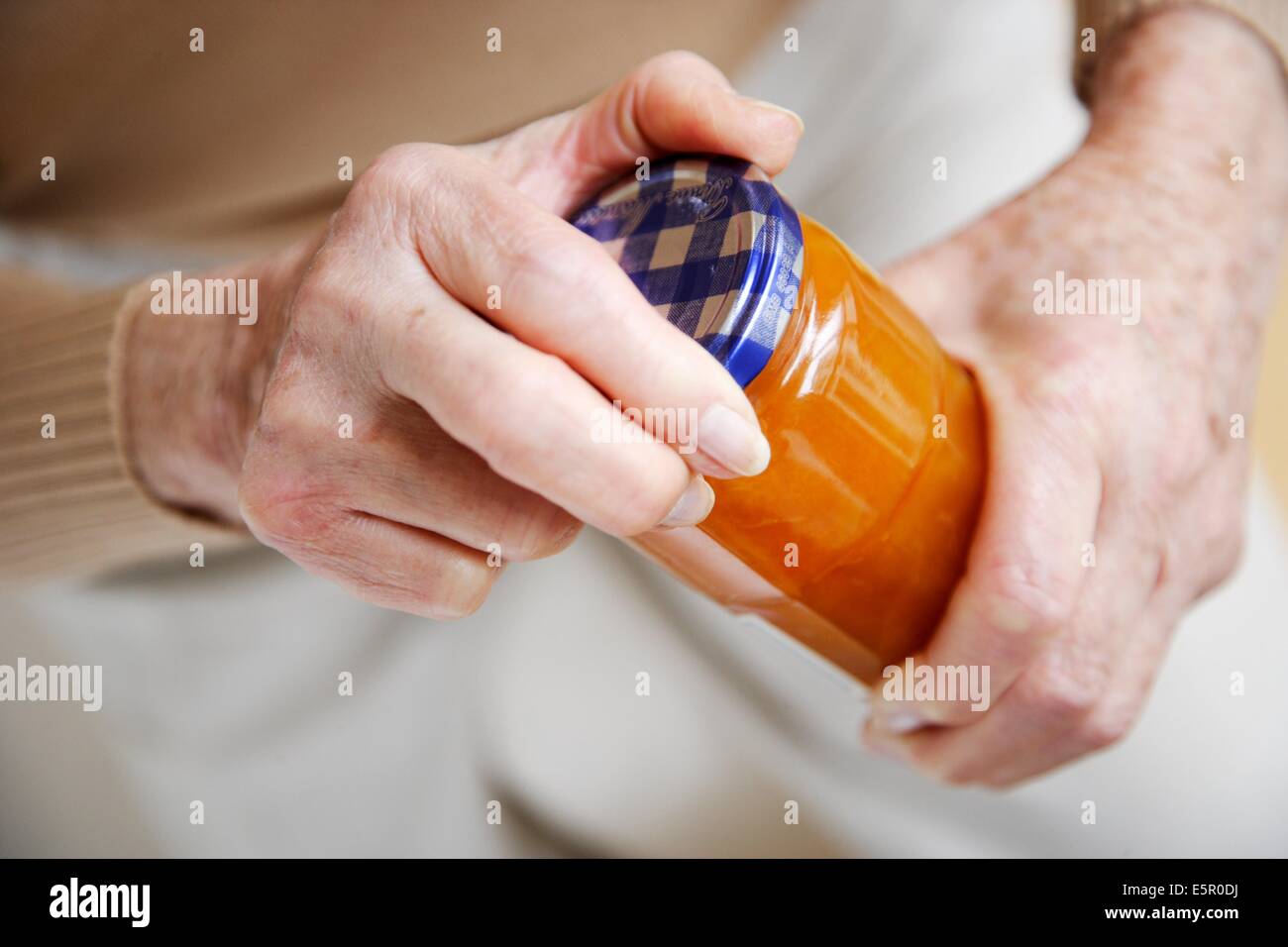 Woman opening a glass jar Stock Photo Alamy