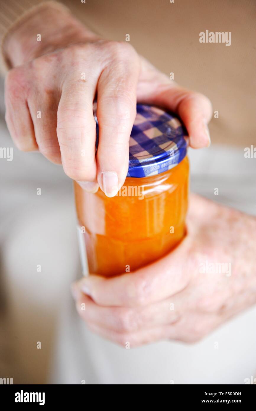 Woman opening a glass jar Stock Photo Alamy