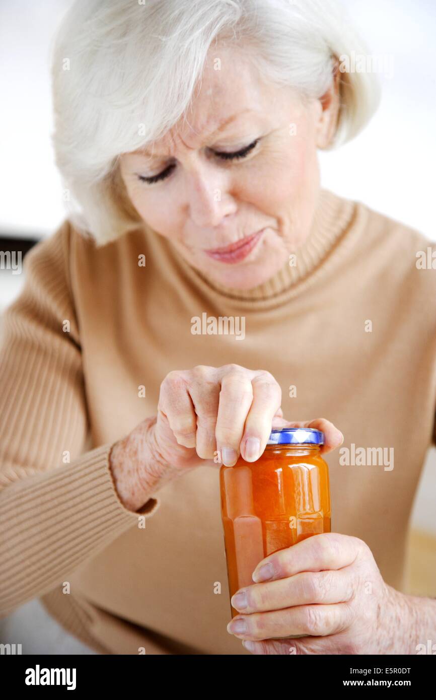 Woman opening a glass jar Stock Photo Alamy
