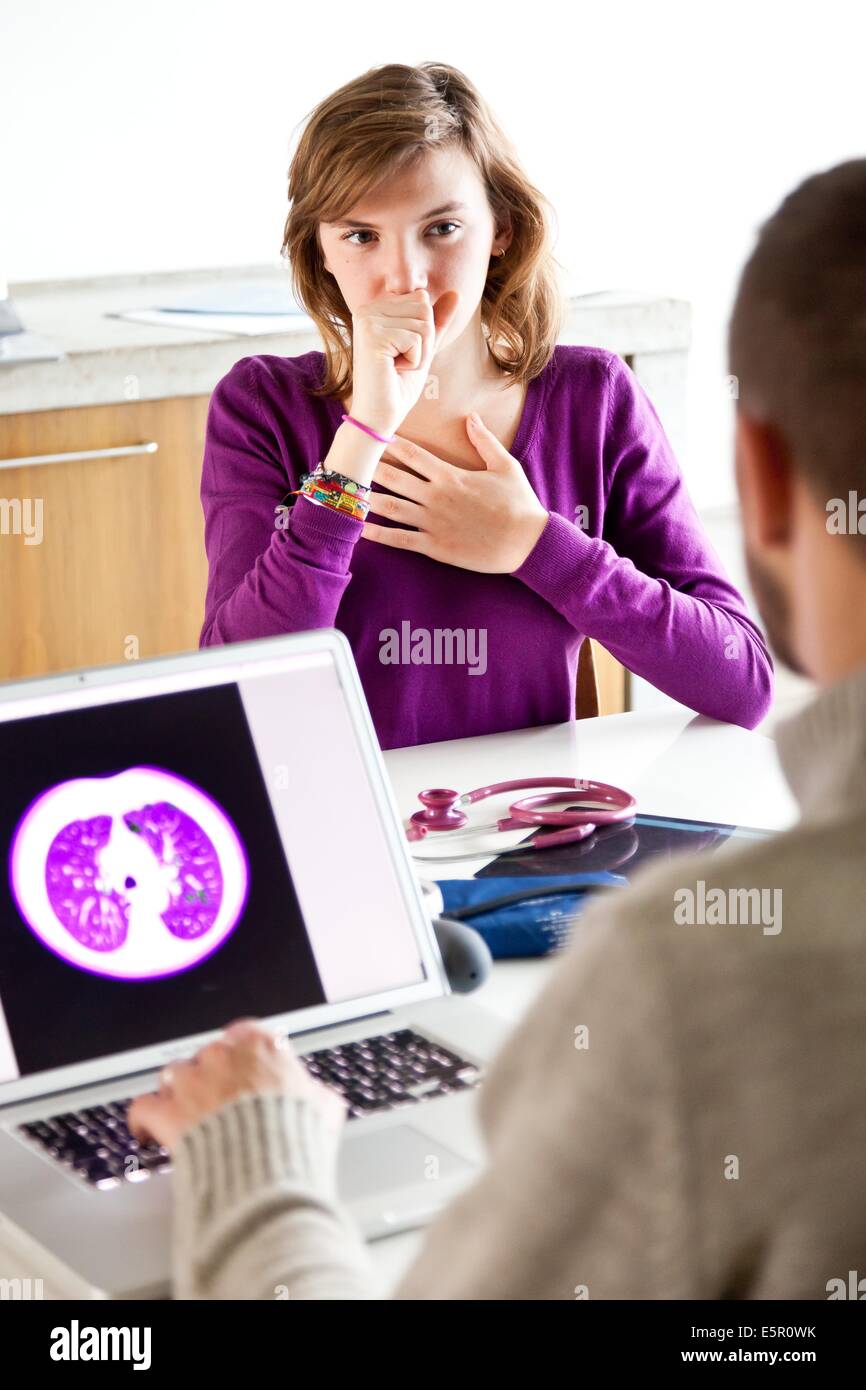 Doctor commenting lungs scan of a patient. Stock Photo