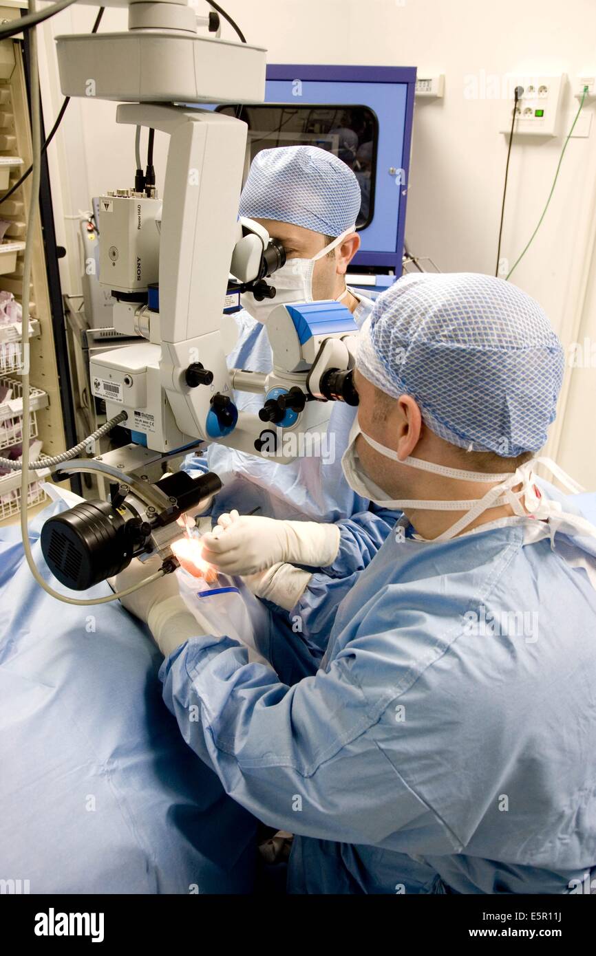 Eye surgeon performing corneal graft Stock Photo Alamy