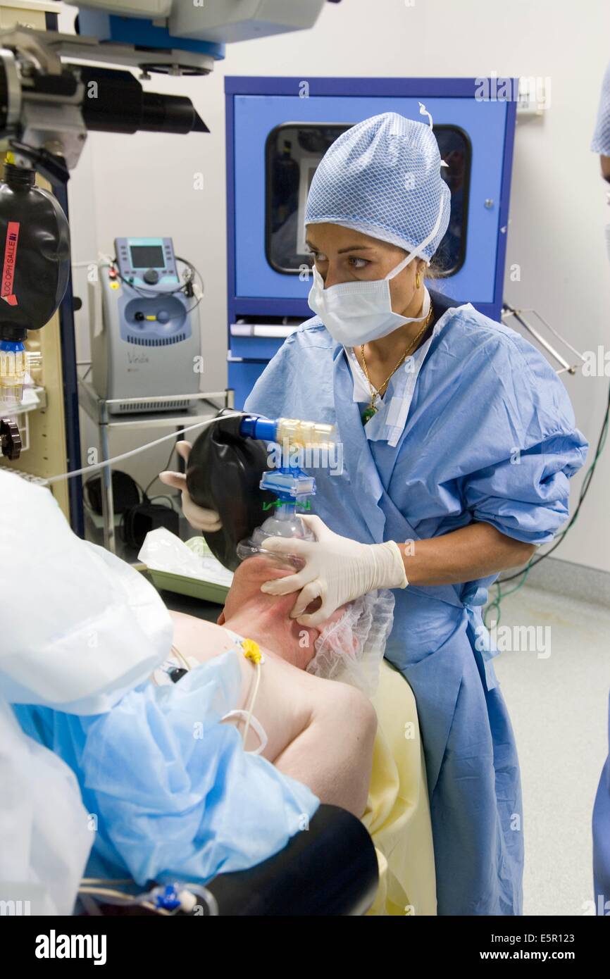 Patient under general anaesthesia, with respiratory assistance mask. Stock Photo