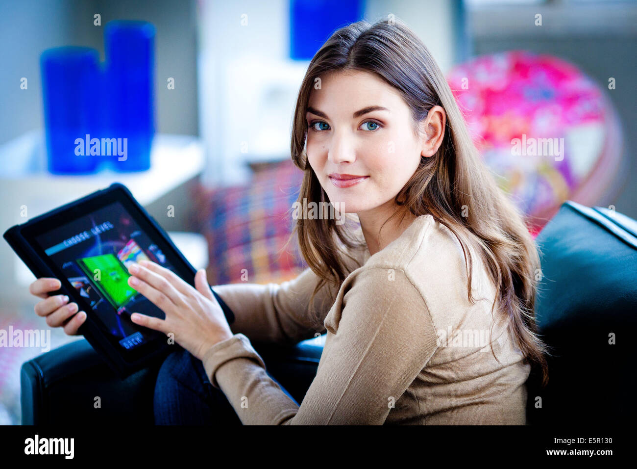 Woman using iPad ®. Stock Photo