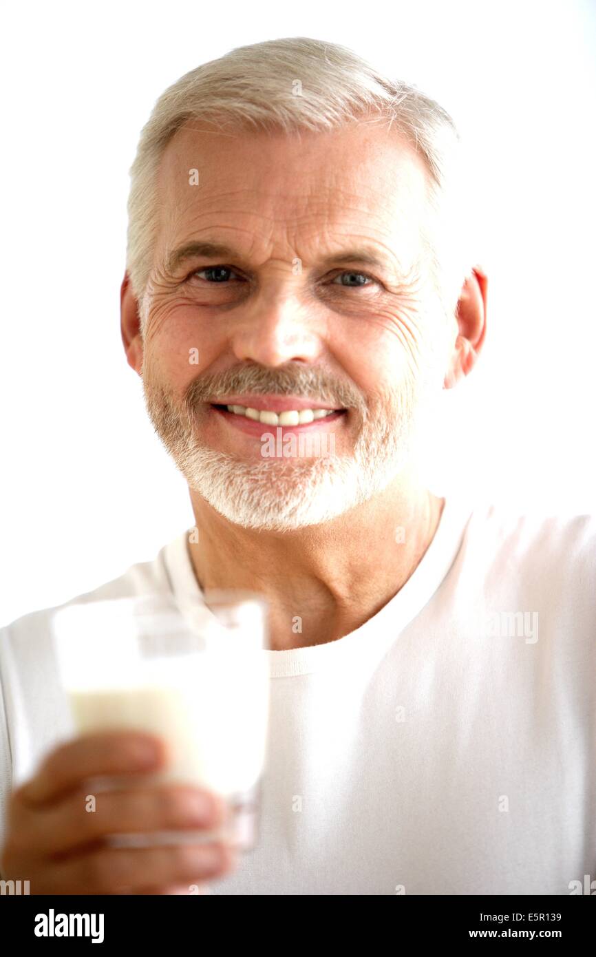 Man drinking a glass of milk Stock Photo Alamy