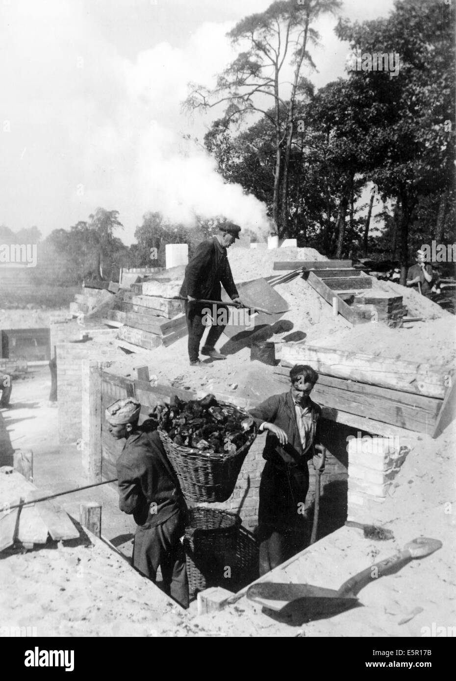 The picture from a Nazi news report shows charcoal piles to simplify the process of providing charcoal to wood gas powered vehicles in Berlin, Germany, September 1944. The wood, which was no longer suitable for construction, was collected from the rubble in the city. Fotoarchiv für Zeitgeschichtee - NO WIRE SERVICE Stock Photo
