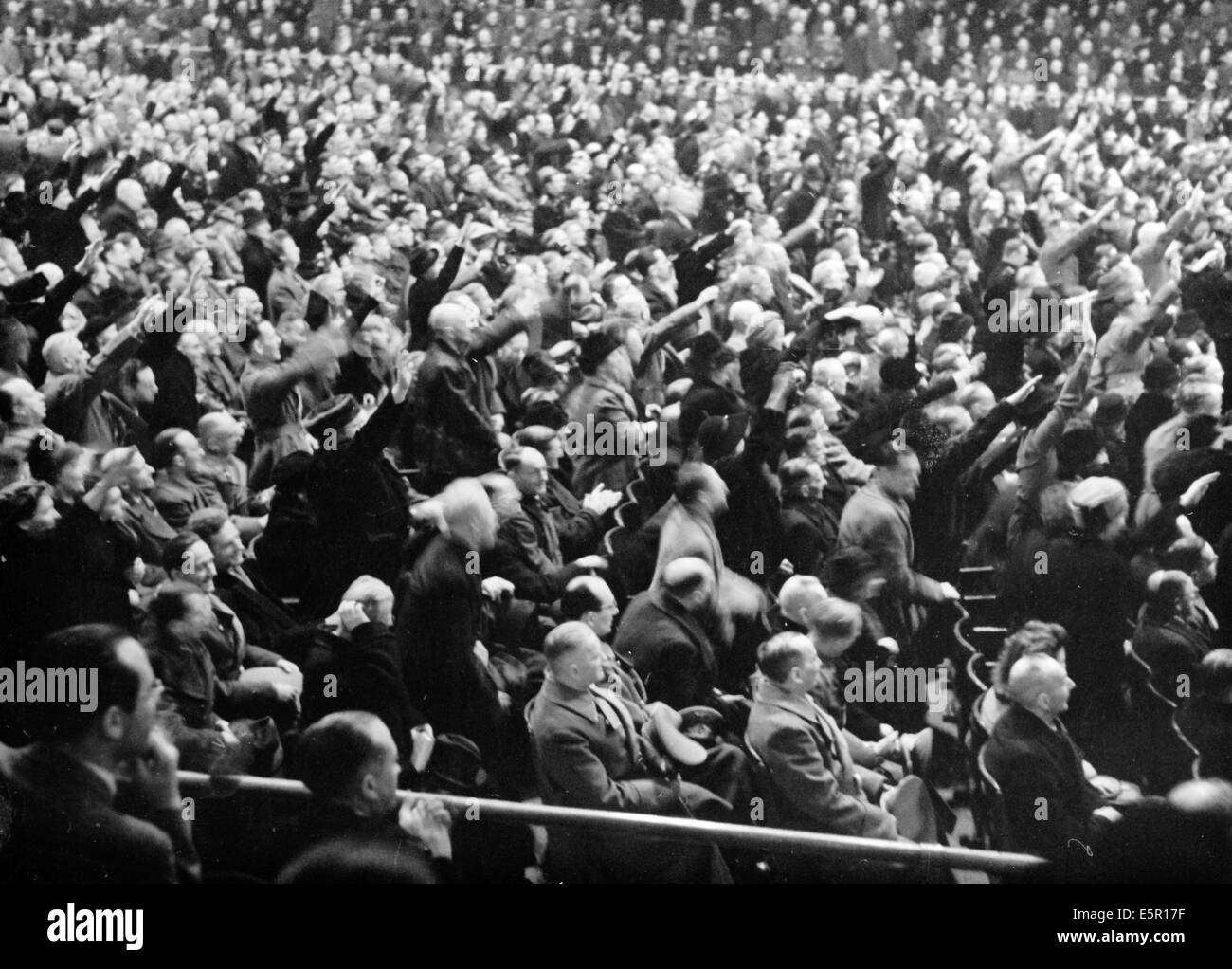 A large group of people listen to the speech by Propaganda Minister Joseph Goebbels, who called for 'total war' at the Sportpalast in Berlin, Germany, 18 February 1943. The original Nazi propaganda text on the back of the picture: 'Fanatical determination by the German people to attain final victory. At the grand rally in the Berlin Sportpalast on Thursday evening, Reich Minister Dr. Goebbels asked the German people ten meaningful questions to which the men and women expressed their willingness to work with a wild passion to attain the final victory in a stormy way.' Photo: Berliner Verlag / A Stock Photo