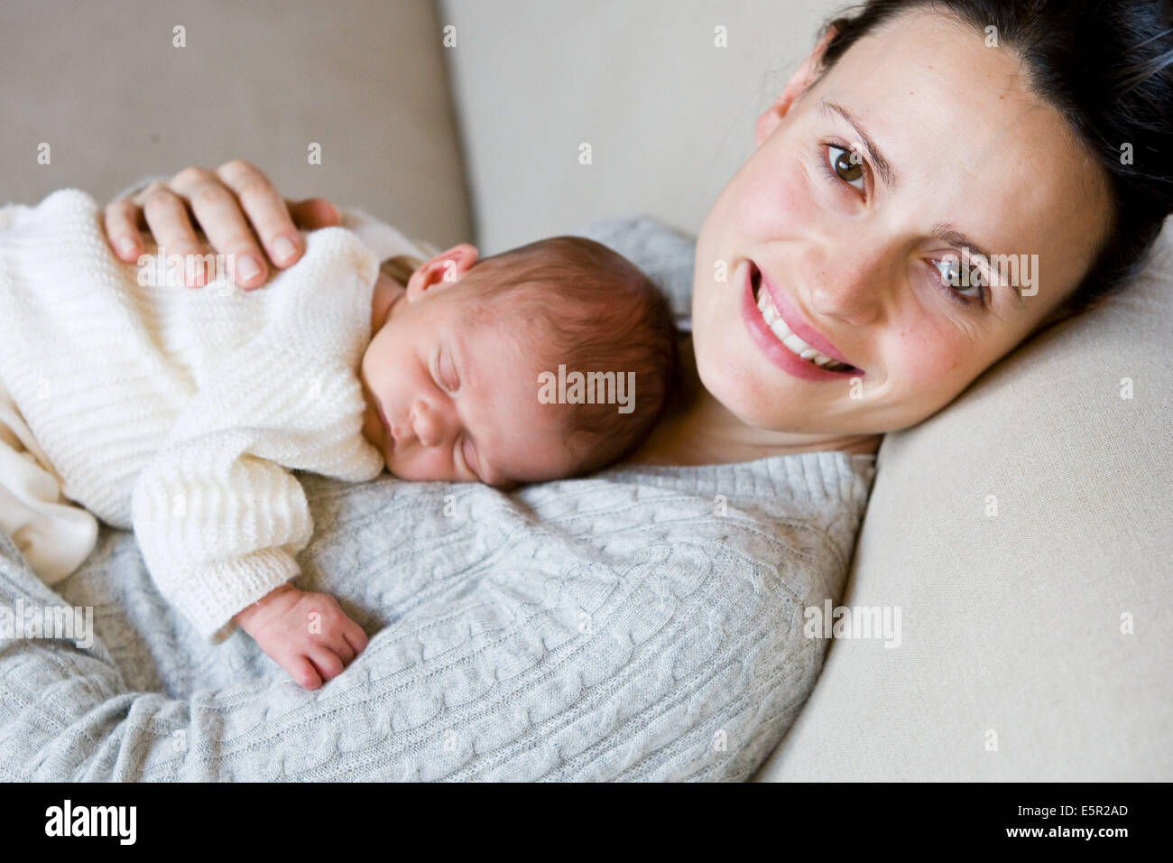3 week old baby with his mother Stock Photo Alamy