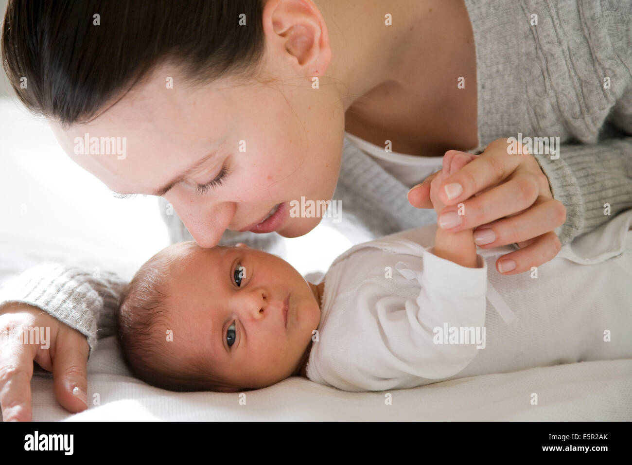 3 week old baby with his mother Stock Photo Alamy