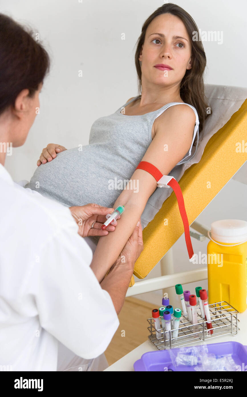 doctor-taking-a-blood-sample-from-a-pregnant-woman-stock-photo-alamy