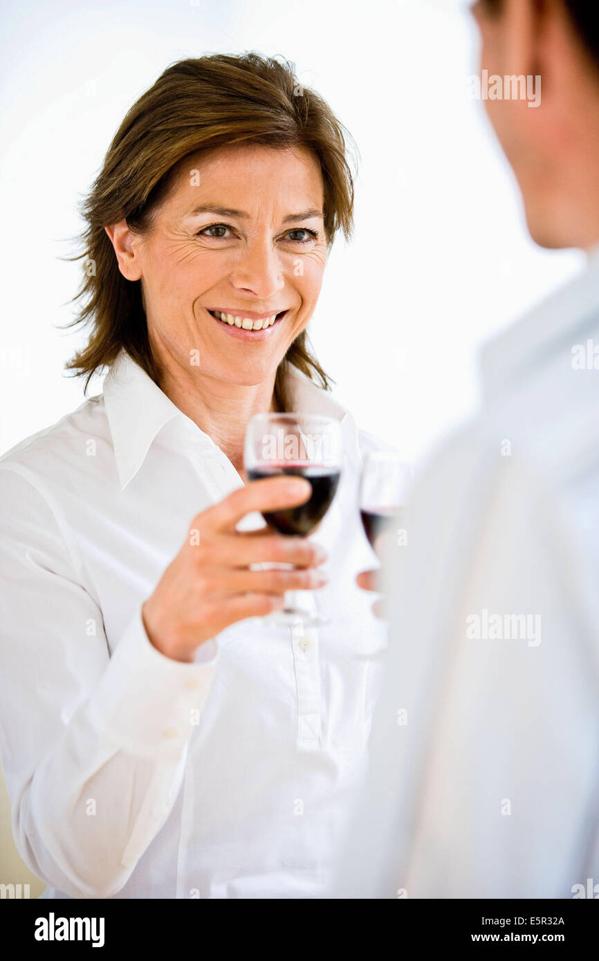 Woman drinking a glass of wine. Stock Photo
