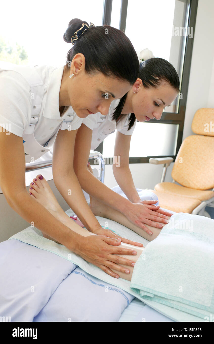 A patient receives hand massages provided by a nurse-sophrologist at the Well being space, Limoges hospital, France. Stock Photo
